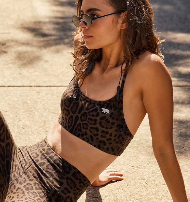 Woman wearing a Running Bare tee